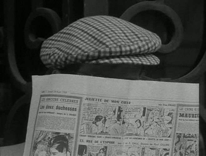 Jean-Luc Godard Spy Through Newspaper GIF