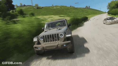 Jeep Driving Down Dirt Road Next To Sports Car GIF