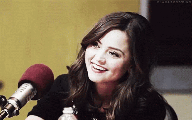Jenna Coleman Smiling Infront Of Microphone GIF