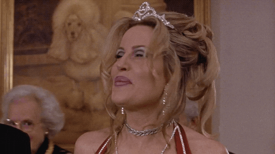 Jennifer Coolidge Wearing A Tiara And Nodding GIF