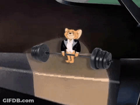 Jerry From Tom And Jerry Is Holding A Barbell On A Box . GIF