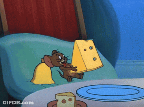 Jerry From Tom And Jerry Is Holding A Large Piece Of Cheese GIF