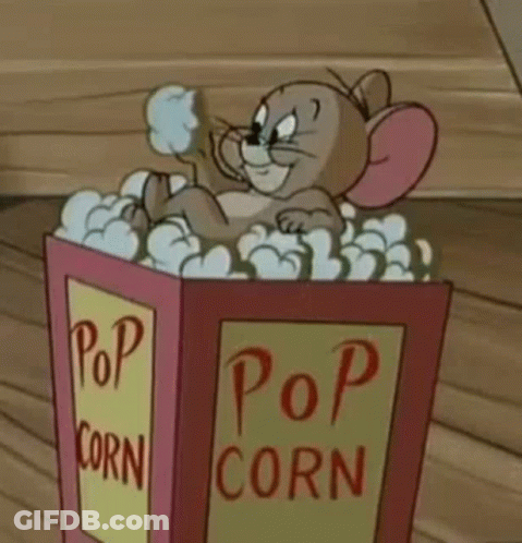 Jerry From Tom And Jerry Is Sitting In A Popcorn Box . GIF