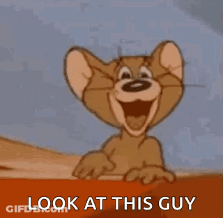 Jerry From Tom And Jerry Is Smiling And Pointing At The Camera . GIF