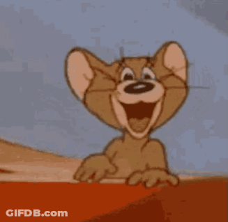 Jerry From Tom And Jerry Is Smiling And Pointing At The Camera . GIF