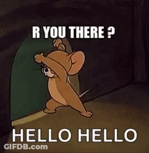 Jerry From Tom And Jerry Is Standing In A Doorway . GIF