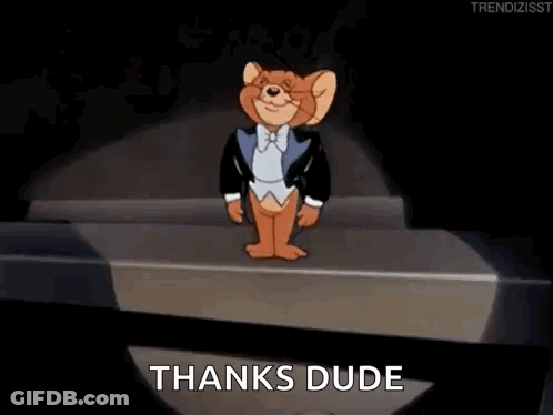 Jerry From Tom And Jerry Is Wearing A Tuxedo And Bow Tie And Is Standing On A Stage . GIF