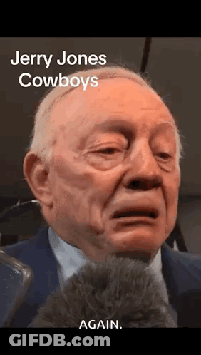 Jerry Jones Crying Into Microphone In Suit And Tie GIF
