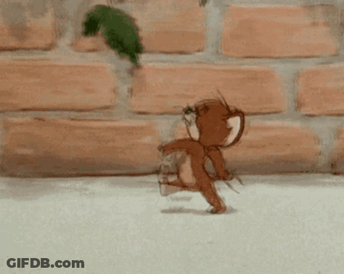 Jerry Running In Front Of Brick Wall GIF