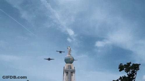 Jesus Statue On Globe With Planes GIF