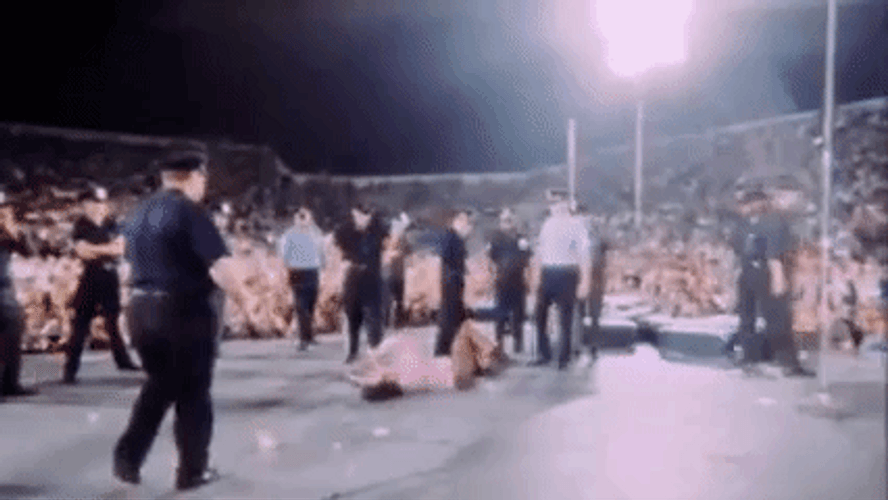 Jim Morrison Surrounded By Policemen GIF