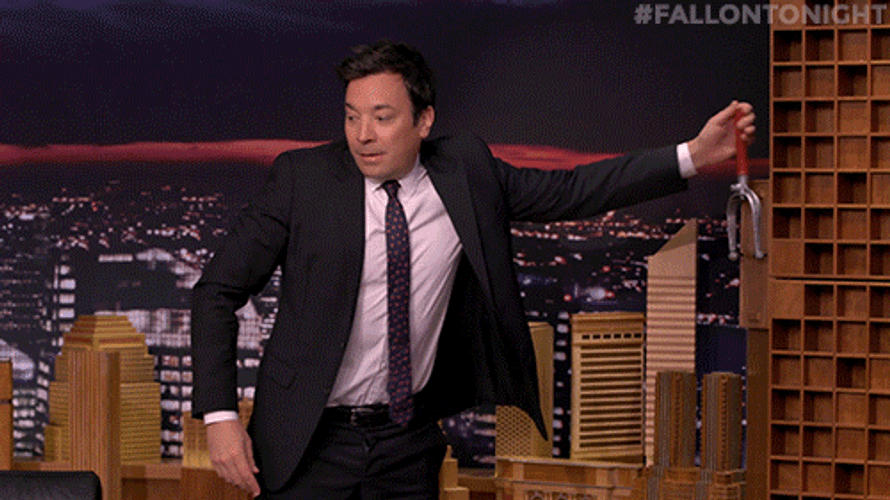Jimmy Fallon Pushing Dominos Falling GIF