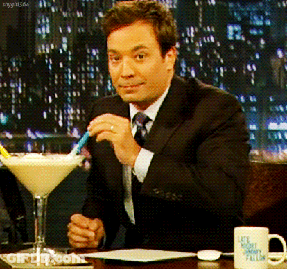 Jimmy Fallon Sitting At Table With Martini Glass GIF