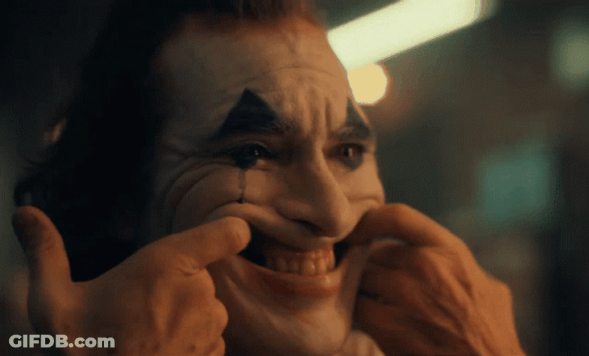 Joaquin Phoenix Joker Laughing Trying His Best GIF