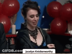 Jocelyn Knickerworthy Sitting At Table With Red Balloons GIF