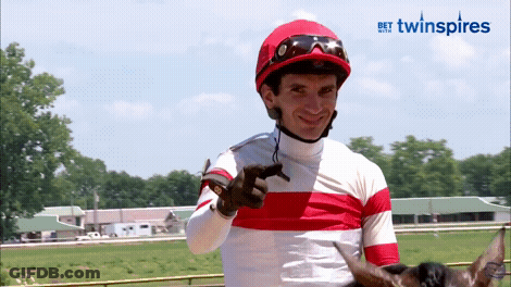 Jockey In Red And White Striped Shirt Pointing GIF
