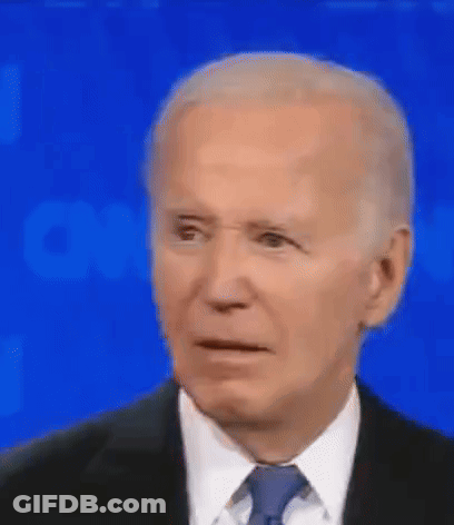 Joe Biden Is Wearing A Suit And Tie And Making A Funny Face . GIF