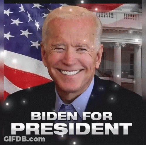 Joe Biden Smiling In Front Of American Flag GIF
