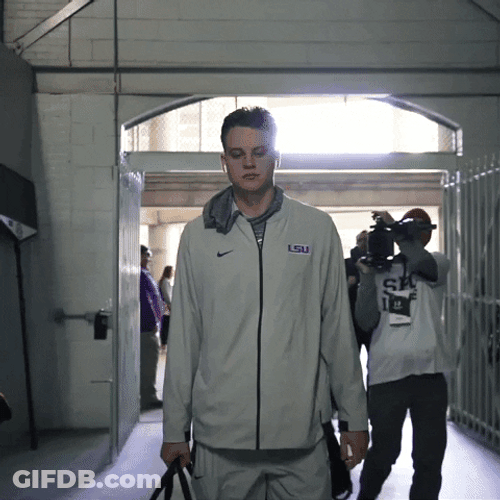 Joe Burrow Player Of Ed Orgeron Walking Inside Building GIF
