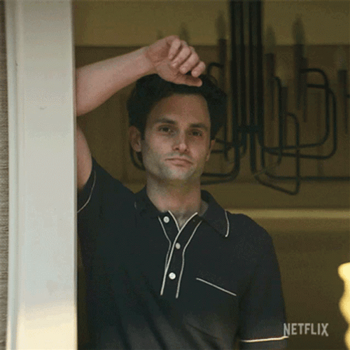 Joe Goldberg Waving Hand Raising Eyebrows GIF