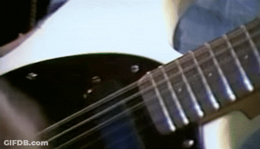 Joey Ramon Ramone Plays Electric Guitar Zoom Out GIF