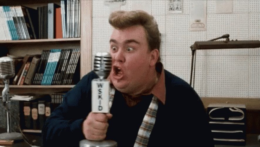John Candy Strangling A Microphone GIF