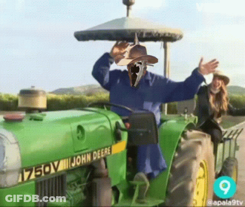 John Deere Tractor With Scarecrow GIF