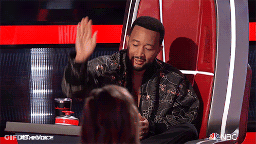 John Legend High Five In Judges Chair GIF