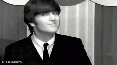 John Lennon In Suit And Tie Making Funny Face GIF