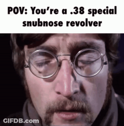 John Lennon Singing Into Mic While Eating Apple GIF
