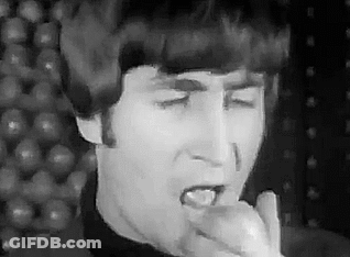 John Lennon Singing Into Microphone Eating Apple GIF