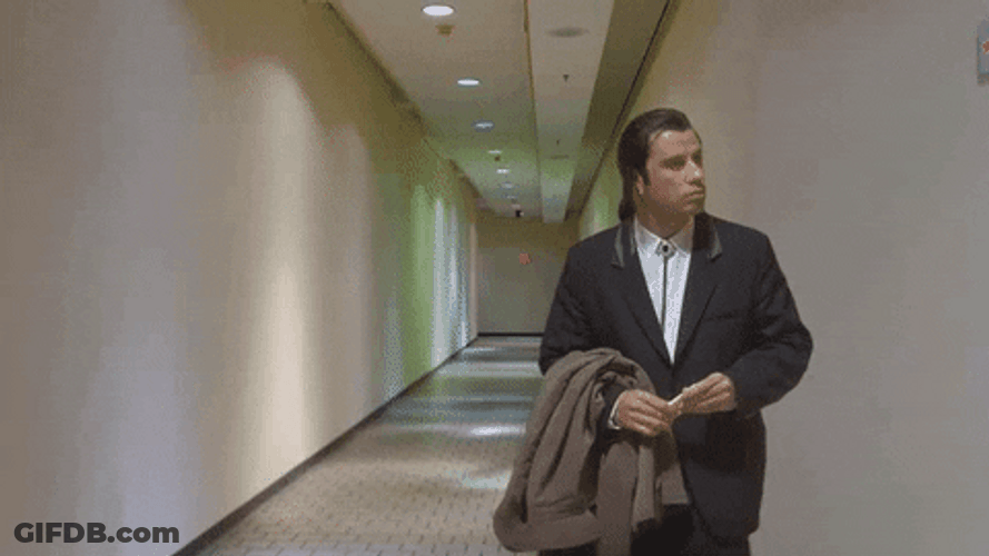 John Travolta Pulp Fiction Empty Hallway GIF