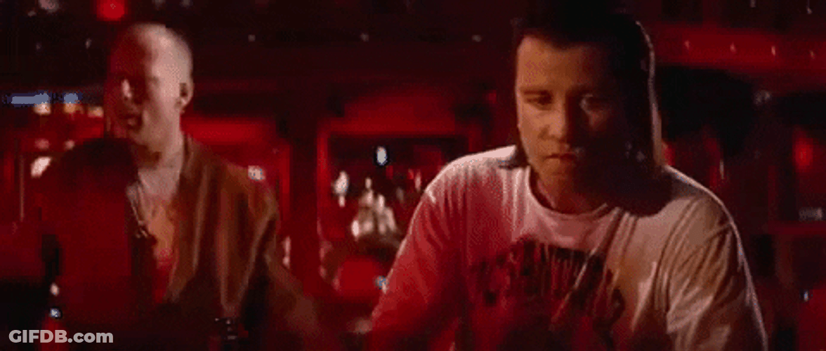 John Travolta Pulp Fiction Staring Bruce Willis GIF