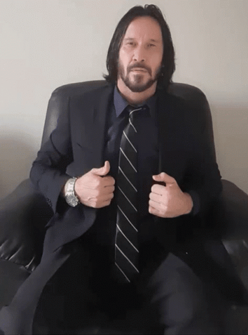 John Wick Slapping His Legs GIF