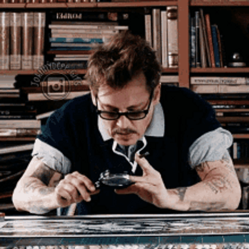 Johnny Depp Searching Using Magnifying Glass GIF