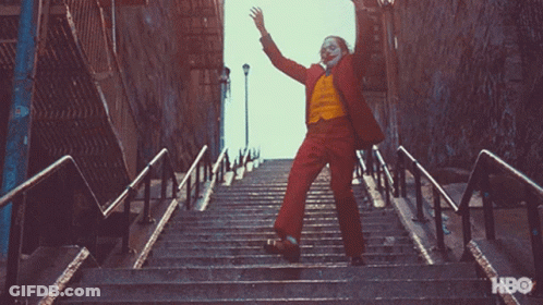 Joker Dancing On Stairs Causing Chaos GIF