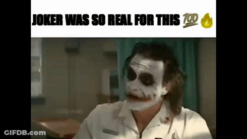 Joker In White Shirt Making Funny Face At Table GIF