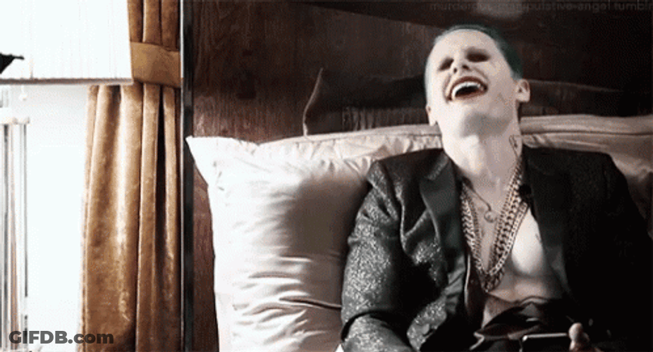 Joker Laughing Lying In His Bed GIF