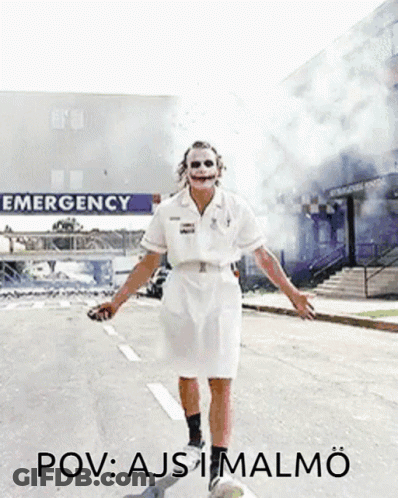 Joker Nurse Walking Past Emergency Sign GIF