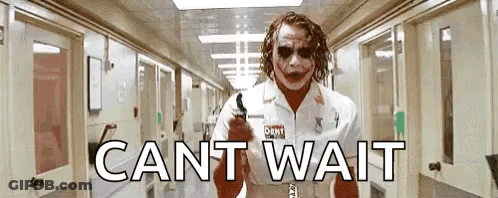 Joker Standing In Hospital Hallway With Gun GIF