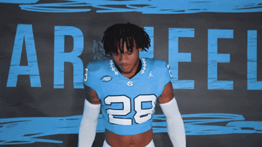 Jolly Athlete Performing Heisman Pose GIF