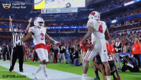 Jonathan Taylor Holding Football With Number 23 Jersey GIF