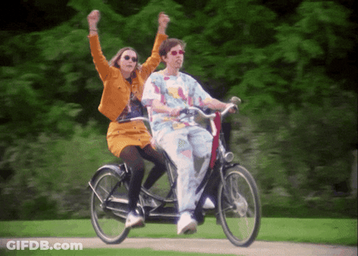 Joyful Biking Duo GIF