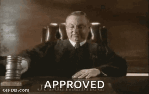 Judge At Desk With Approved Sign GIF