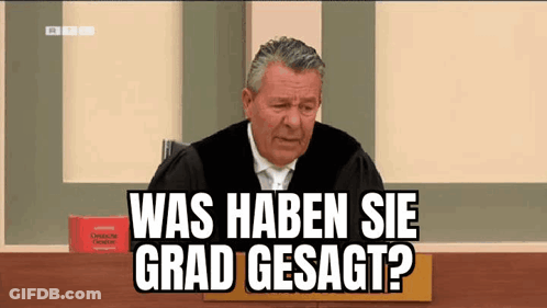 Judge In Robe Sitting In Front Of Book GIF