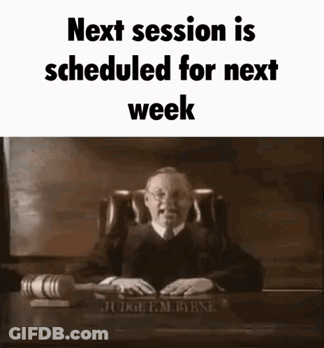 Judge Sitting At Desk With Gavel And Nameplate GIF