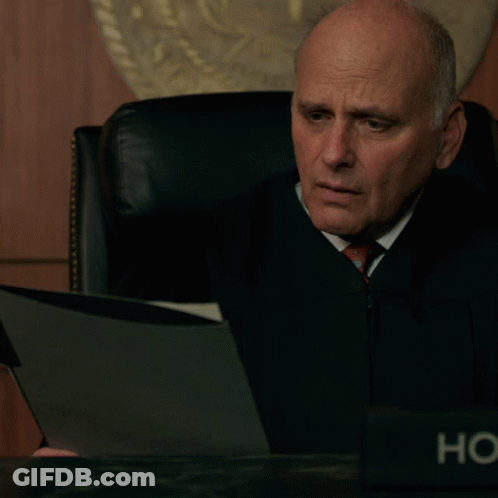 Judge Sitting At Desk With HC Name Plate GIF