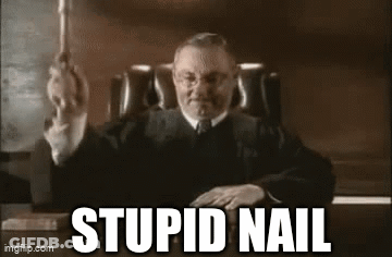 Judge Sitting At Desk With Stupid Nail GIF