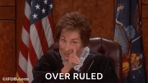 Judge Sitting In Court With Hand On Face GIF