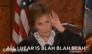 Judge Sitting In Front Of American Flag GIF